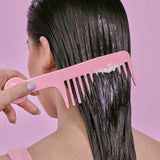 Mermade Hair Repair Mask put on hair with a comb